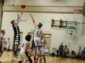 Hawk Connor Mitchell takes a shot Nov. 30, when the County Central High School senior varsity boys' team opened the season on the road against Nanton's J.T. Foster High School. The Hawks won the contest 62-38. STEPHEN TIPPER