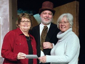 On the set of A Christmas Carol, from left to right, are theatre Treasurer Jane Hammond, Trevor Finkenzeler (Ebenezer Scrooge) and Joanne Claussens from the Ingersoll and District Inter-Church.  
(Mark Henkell/Special to the Sentinel-Review)