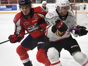 Alex Christopolous and Teddy Sawyer clash in the corner as the Owen Sound Attack host the Windsor Spitfires inside the Harry Lumley Bayshore Community Centre on Saturday, Dec. 17, 2022. Allison Davies/Owen Sound Attack