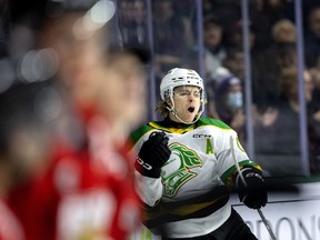 Sean McGurn of the Knights celebrates near the Attack bench as she opens the scoring Friday night at Budweiser Gardens against the Owen Sound Attack. 
The Knights scored 4 in the first against a befuddled Attack team that was having issues. 
Photograph taken on Friday December 16, 2022. 
Mike Hensen/The London Free Press/Postmedia Network