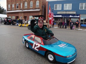 Ramoca Shrine Club President David Madill waves to the crowd from his No. 12 small car during the Chatsworth Santa Claus parade Saturday, Dec. 17, 2022 in Chatsworth, Ont. (Greg Cowan/The Sun Times)