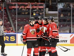 Members of the Owen Sound Attack, from left to right, Cedrick Guindon, Colby Barlow, Sam Sedley and Deni Goure celebrate Thursday night in Barrie as the Attack rolled to a 5-2 win over the Colts. Photo by Allison Kennedy Davies/Attack Hockey
