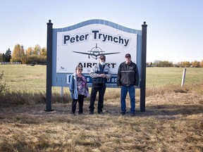 Peter Trynchy, centre, was honoured with the renaming of the Mayerthorpe Airport in 2020. The former MLA for Whitecourt passed away on Nov. 21.