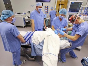 A Quinte Health Care surgical team tends to a patient after an operation. LUKE HENDRY FILE
