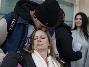 Sarah Sansom is comforted by William Cardinal outside the Edmonton Law Courts after Anthony Bilodeau was sentenced to life in prison with no chance of parole for 13 years in the killing of Jacob Sansom and Maurice Cardinal, Thursday Jan. 6, 2023. Sansom's husband Jacob Sansom, a the Metis hunter, was killed in Glendon, Alberta in 2020. Photo By David Bloom