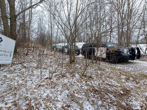 Police vehicles are parked on a section of the rail trail near the end of Concession 11 near Owen Sound on Tuesday, January 10, 2023.