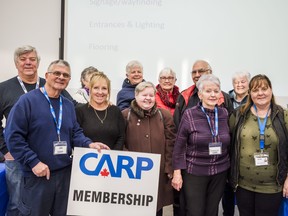 From right, Jennifer Loner, a public education coordinator with the Alzheimer's Society of Hastings and Prince Edward, stands alongside members of the Greater Bay of Quinte Area CARP chapter after her informative talk on dementia on Tuesday in Belleville, Ontario. ALEX FILIPE