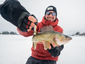 Jeff Gustafson changes out the stock treble hooks on his ice fishing spoons for better quality Gamakasu hooks to increase his fish landing percentage.
