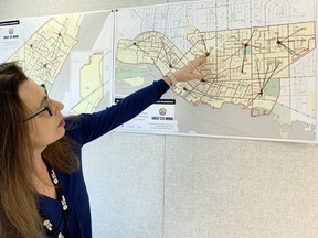 City clerk Rachel Tyczinski points out how the city's voting subdivisions are divided up and sorted. Factors considered include the size of the voting station and the population of electorate in the surrounding area.   ELAINE DELLA-MATTIA