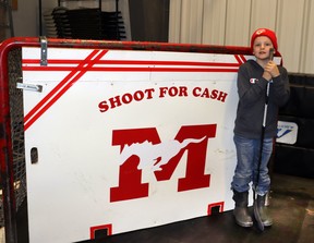 Ryder Prutton, 10, an Elmer Elson Elementary School student, won $300 during intermission with a shot for cash.