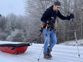 Mike Duhacek trains for his helpmeburycancer "Double Up" event to raise awareness and funds for the Canadian Cancer Society. Duhacek, the 2023 Canadian Ambassador of Cops for Cancer, will pull a heavy snowmobile sled carrying the word "cancer" made of pine. His trek will take him more than 200 kilometres from Georgian Bay to Lake Ontario. He is set to leave Kelso Beach at Nawash Park in Owen Sound on Feb. 4 at 7 a.m.