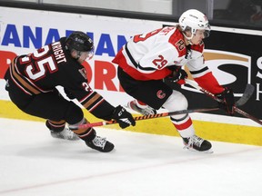 Chase Wheatcroft (right), native to Calgary, put up a goal and two assists Wednesday night against the Hitmen.
