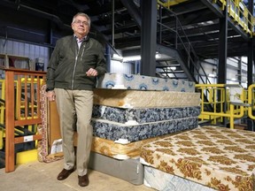 John Shalewa, president of Ukrainian Canadian Social Services, with some donated beds in Edmonton on Tuesday, Jan. 17, 2023. His organization has teamed up with the Ukrainian Canadian Congress-Alberta Provincial Council, Catholic Social Services, and Sherwood Park's Sleep in Heavenly Peace organization to supply beds in support of families in the Edmonton area who fled the war in Ukraine. Larry Wong/Postmedia