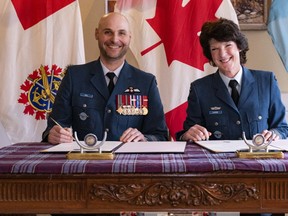 The new 8 Wing Honorary Colonel , Ms. Julie Lange (right) is joined by Colonel Leif Dahl, 8 Wing Commander (left), as Ms. Lange formalizes her investiture as the Wing’s Honorary Colonel during a ceremony at 8 Wing, Trenton, Ontario, on January 19, 2023. Photo by: Corporal Luke Barrie, 8 Wing Trenton Imagery Technician.