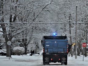 WINTER WONDERLAND Belleville residents awoke to freshly fallen snow Monday that blanketed Old East Hill. A municipal public works truck sanded Queen Street under a canopy of dusted boughs and branches to make city streets a little less slippery for morning commutes. More snow is expected this week beginning Wednesday, forecast Environment Canada. DEREK BALDWIN