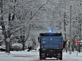 WINTER WONDERLAND
Belleville residents awoke to freshly fallen snow Monday that blanketed Old East Hill. A municipal public works truck sanded Queen Street under a canopy of dusted boughs and branches to make city streets a little less slippery for morning commutes. More snow is expected this week beginning Wednesday, forecast Environment Canada. DEREK BALDWIN