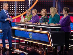 Family Feud Canada host Gerry Dee chats with the Bruce Peninsula's Cunningham family, from left, Connie Clark with a Wiarton Willie model, Linda Bain, Doris Jackson, Mary-Jane Hewitt, and Lenora Clark during an episode of the game show. The episode aired on Wednesday night at 7:30 p.m. on CBC, while past episodes can be streamed free on CBC Gem.