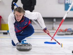 Scottish curler James Young from Aberdeenshire pensively watches the scoring target as he releases a curling iron down the ice at the Trenton Curling Club on Thursday in Trenton, Ontario. ALEX FILIPE