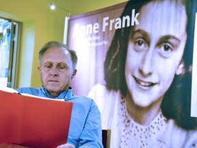 Stratford Perth Museum general manager John Kastner reads through some of the reflections recorded by those who visited the museum's Anne Frank: A History for Today exhibit, on loan from the Anne Frank House in Amsterdam, before it closes after more than two years in Stratford. Galen Simmons/The Beacon Herald/Postmedia Network