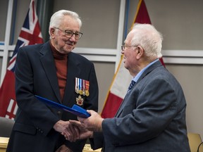 Robert John Findlay receives the Sovereign's Medal for Volunteers from Quinte West Mayor Jim Harrison on Wednesday afternoon in Trenton, Ontario. ALEX FILIPE
