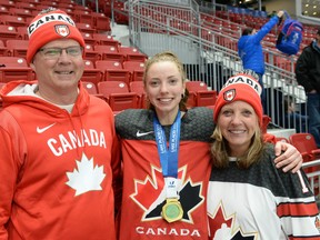 Hannah Tait celebrates alongside her parents Rob and Irene in Lake Placid after winning the gold medal game. Handout