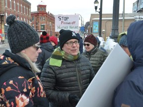 Ontario Green Party leader Mike Schreiner talks to those participating in a rally on the Gitche Namewikwedong Bridge on 10th Street in Owen Sound on Tuesday, January 31, 2023. At left is rally organizer Danielle Valiquette.