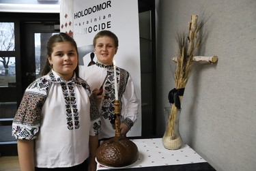 Maksym Dika, 9, and his sister, Yuliiya, 7, who escaped the war in Ukraine with their mother, light a candle of remembrance for Holodomor Memorial Day at the Ukrainian Centre in Sudbury, Ont. on Thursday November 24, 2022. Holodomor Memorial Day is on Nov. 26 and is held to honour Òthe millions of Ukrainians who were starved to death during the Holodomor famine-genocide implemented by Joseph Stalin in 1932-33,Ó said a release issued by the Ukrainian Centre. John Lappa/Sudbury Star/Postmedia Network