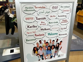 The multi-language greeting sign at the Airdrie Public Library.