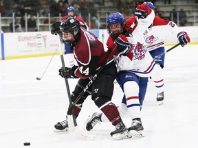 Chatham Maroons' Brendan Gouin (44) battles Strathroy Rockets' Damian Pancino (12) in the third period at Chatham Memorial Arena in Chatham, Ont., on Sunday, Jan. 29, 2023. Mark Malone/Chatham Daily News/Postmedia Network