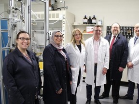 (L-R) Cibele Halmenschlager, Hanan El-Sayed, Andrea Kent, Francis Drouin, Dr. Arno De Klerk, and Dr. Walter Dixon pose at the University of Alberta lab. Photo by James Bonnell.