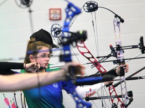 Delia Therriault of Team Yukon competes against Team Alberta during compound archery at Shell Place during the Arctic Winter Games on Tuesday, January 31, 2023. Vincent McDermott/Fort McMurray Today/Postmedia Network