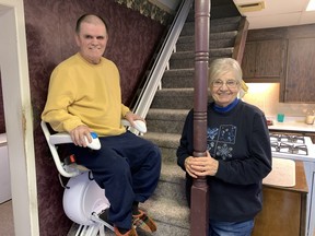 Robbie Logan demonstrates his new stair-lift, purchased by the Waterford Lions Club, Waterford Firefighters and Waterford Lioness Club through a hugely successful bottle drive on Saturday.