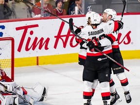 Scott Sabourin celebrates with teammates after his overtime winning goal Wednesday in a 2-1 victory over the Laval Rocket at Place Bell. BELLEVILLE SENATORS