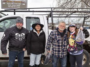 Scott Benoit (left) of Woodstock decided to bring Lesley Richards, Shane Welsh and Ellen Herron II to Port Dover on Friday in his pickup truck after an overnight snowfall thwarted his plans to ride his motorcycle for the traditional Friday the 13th gathering.  Brian Thompson