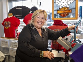 Elaina Pring, owner of On The Fringe in downtown Port Dover was busy adding January 2023 to Destination 13 t-shirts she was selling on Friday January 13, 2023 in Brantford, Ontario.  Despite few riders, the shop was packed with people wanting to purchase shirts marking the traditional Friday the 13th Gathering.  Brian Thompson/Brantford Expositor/Postmedia Network