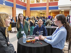 Lyssa Kelly, a controls designer in the HVAC industry speaks to female students during the Women in STEM Conference on Monday at Assumption College.