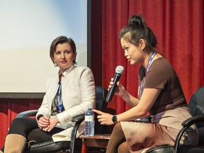Aerospace engineer Elena Miroshnichenko (left) listens as data scientist Sarah Sun speaks to students.