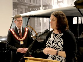 United Counties of Leeds and Grenville Warden Nancy Peckford speaks during Brockville's New Year's Day Levee while Brockville Mayor Matt Wren listens, amid the displays at the Brockville Museum. (RONALD ZAJAC/The Recorder and Times)