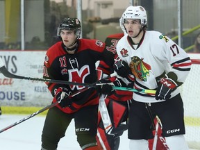 Jackson Barnes (left) of Nepean and Matt Yeager of Brockville watch the play from in front of the Raiders' net at the Brockville Memorial Centre on Friday, Jan. 6. Yeager scored a power-play goal for the Braves in their 5-0 win over Nepean at the CCHL Winter Showcase in Kemptville on Tuesday, Jan. 10.
Tim Ruhnke/The Recorder and Times