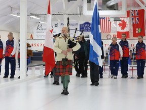 Piper Rob Miller leads Strathcona Cup participants up the ice of the Prescott Curling Club during the opening ceremony on Saturday morning.
Tim Ruhnke/Postmedia Network