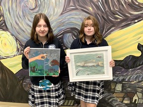 Grade 11 Ursuline College Chatham students Sabrina Knelsen (left) and Elizabeth Forgeron, both 16, display their artwork that will be part of the 