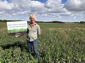 Yajun Peng, a University of Guelph graduate student at the Ridgetown Campus, has received recognition at a prestigious scientific meeting for her work on cover crops and soil and water management. The photo shows Margaret Kroes, who farms with husband Jack near Clinton, with a sign that promotes the use of cover crops in Southwestern Ontario farms. Handout
