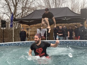 The team from Handy Brothers paricipating in the Polar Plunge at Sons of Kent Brewery on Saturday were having a great time.  PHOTO Ellwood Shreve/Chatham Daily News