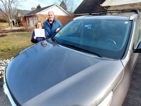 Kathy and Henry Vandergriendt were like many Chatham-Kent residents who took in stranded motorists to their home during the severe winter storm that hit the region just before Christmas.  But the Ridgetown couple took their generosity to the next level by offering a Kitchener family the use of their vehicle so they could make it to a large family Christmas celebration in Michigan.  Here, the Vandergriendt's display a thank you card signed by the family they helped and several relatives.  PHOTO Ellwood Shreve/Chatham Daily News