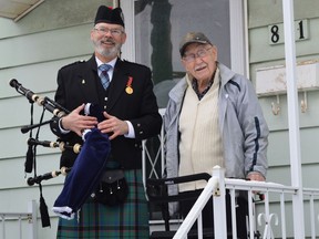 From left to right, piper and veteran (Royal Canadian Air Force) Ken Stephens stands with Second World War Royal Canadian Air Force veteran Les Foulds who celebrated his 103rd birthday on Tuesday January 24, 2023 in Cornwall, Ont. Shawna O'Neill/Cornwall Standard-Freeholder/Postmedia Network