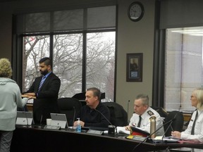 Cornwall clerk Manon Lesvesque, left and facing away from the camera, administers the Cornwall police services board oaths to Mayor Justin Towndale, as the other new member Coun. Maurice Dupelle, Deputy Chief Vincent Foy, and Chief Shawna Spowart observe, at the start of the board's meeting on Thursday January 12, 2023 in Cornwall, Ont. Hugo Rodrigues/Cornwall Standard-Freeholder/Postmedia Network