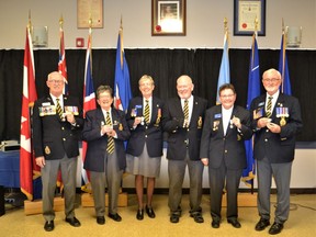 Members of the High River Legion were honoured with Queen Elizabeth II Platinum Jubilee Medals. From left, John Mahon, Barbara Andersen, Linda Reed, Timothy Whitford, Dr. Linda Ormson, and Robert Collins.
