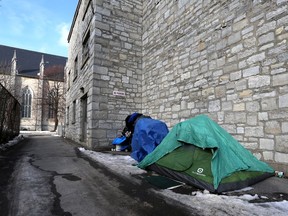 A tent and a collection of belongings sit outside the St. Mary's Parish Centre on Brock Street in downtown in December 2022.