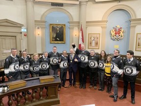 Kingston city councillors don Kingston hockey jerseys following their Tuesday, Jan. 17, 2023, meeting, at which they pledged the city's financial support to a bid for the 2024 Memorial Cup.