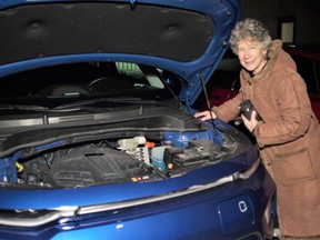 Pam Dunlop and her electric KIA Soul. Dunlop was one of nine local EV owners who attended a gathering at Burk's Falls to explain why EVs are better for the environment. Rocco Frangione/Local Journalism Initiative